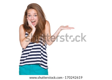 Surprised woman showing open hand palm with copy space for product or text