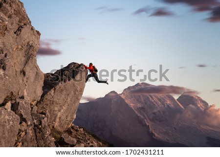 climber with great willpower reaching the top 