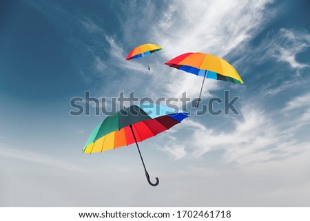 Abstract floating umbrella in the sky, conceptual photography