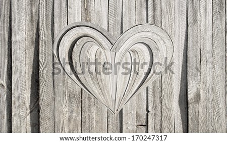 wooden heart on a wooden background