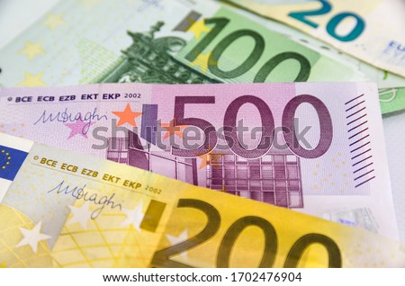 different euros for background. View from above. Royalty-Free Stock Photo #1702476904