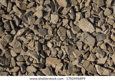 photo background stones lay on a flat surface on the ground in natural light