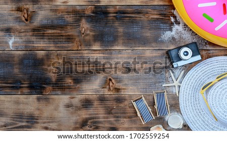 Beach accessories on the wood background. Summer Mid year sale. Online shopping for special promotion concept and free home delivery.