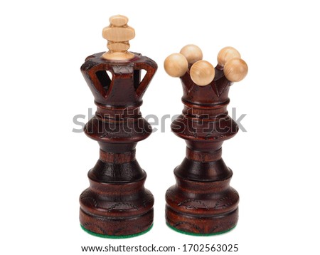 black chess queen and king on white background, close-up