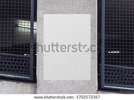 White wrinkled poster template. Glued paper mockup. Blank wheatpaste on textured wall. Empty street art sticker mock up. Clear urban glued advertising canvas. Royalty-Free Stock Photo #1702572367