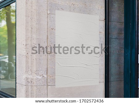 White wrinkled poster template. Glued paper mockup. Blank wheatpaste on textured wall. Empty street art sticker mock up. Clear urban glued advertising canvas. Royalty-Free Stock Photo #1702572436