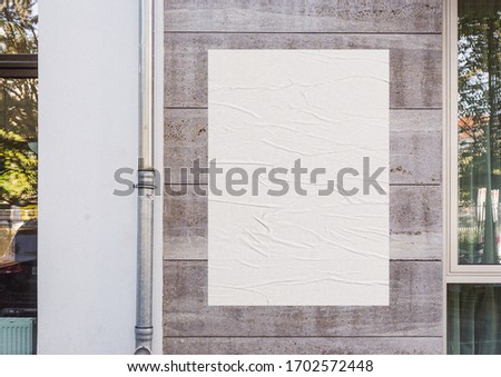White wrinkled poster template. Glued paper mockup. Blank wheatpaste on textured wall. Empty street art sticker mock up. Clear urban glued advertising canvas. Royalty-Free Stock Photo #1702572448