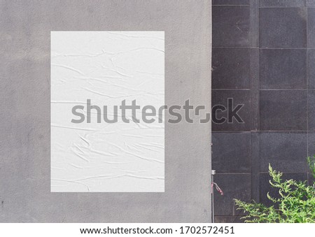 White wrinkled poster template. Glued paper mockup. Blank wheatpaste on textured wall. Empty street art sticker mock up. Clear urban glued advertising canvas. Royalty-Free Stock Photo #1702572451