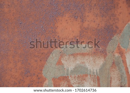 Rusty metal texture with abstract paint pattern, background of oxidized old iron. Electoral focus.