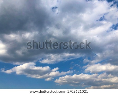 White tiny cloudy with vast blue sky during day. Season change as dark cloud to be rainy atmosphere. Softness motion natural background.