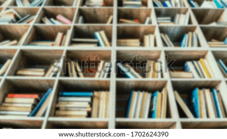 Book background. Blurred background with books on library shelves.