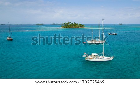sailing yachts at anchor in the turquoise colored waters of the San Blas Islands, Kuna Yala, Panama Royalty-Free Stock Photo #1702725469