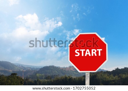 start sign on the blue sky.start warning traffic sign on a road