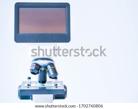medical microscope with a screen on a white background