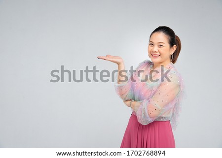 asian mature women point her hand on the space - idea for family quote