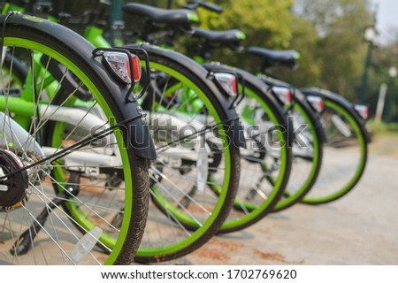 New green bicycles lined up on the road - Modern concept of ecological transportation - Bike urban transport