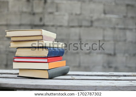 Books on a wooden box, books in an industrial setting Royalty-Free Stock Photo #1702787302