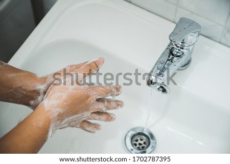 Close up Male hands washing hands with soap. for corona virus prevention.