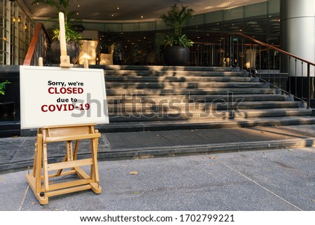 restaurant, hotel, company, shopping center closed due to coronavirus or covid-19 pandemic outbreak lockdown. coronavirus news temporarily closed board in front of building after government shutdown Royalty-Free Stock Photo #1702799221
