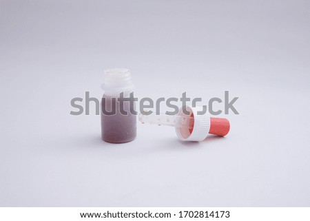 the bottle containing the vaccine
