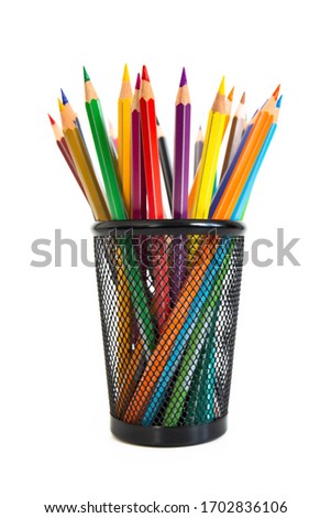 Bunch of colored pencils in a pencil holder. Macro still-file picture taken in studio with white background and softbox.