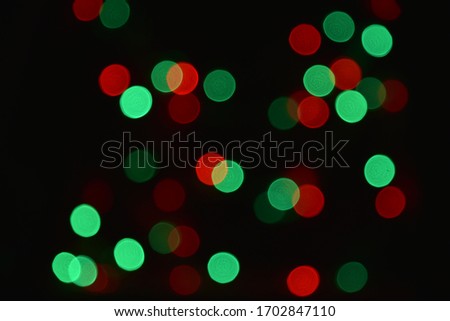 Abstract green and red bokeh background.