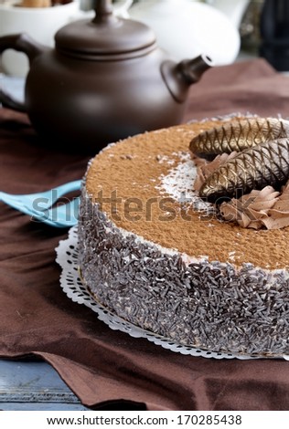 gourmet chocolate cake with festive decorations and vanilla cream