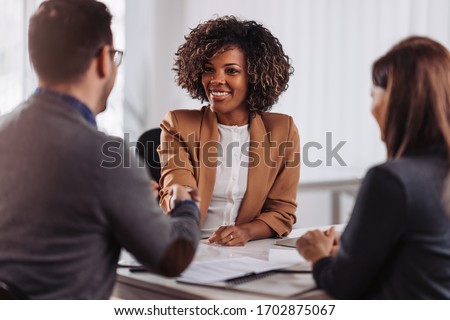 Business people shaking hands after meeting Royalty-Free Stock Photo #1702875067
