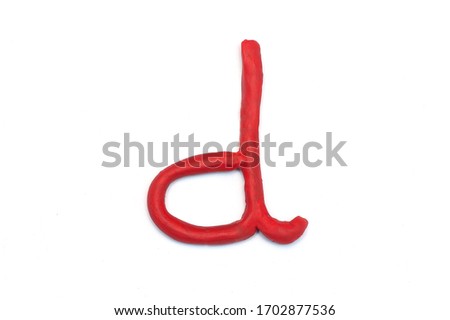 letter "d" from red plasticine. Part of the word "day" Preparation for the holiday. Mothers Day
