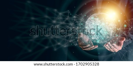 Man's hands holding virtual digital earth planet with light and line graphic decoration. Save earth concept. Global connection technology concept. Graphic design for background and banner.