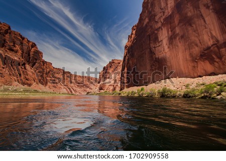 colorado river with gorgeous sandstone walls and canyons  Royalty-Free Stock Photo #1702909558