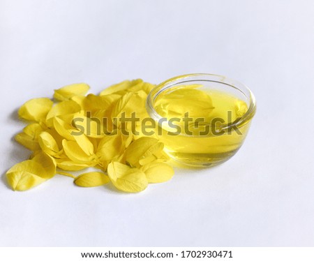 Golden shower extract and scattered petals