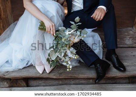 the bride holds a wedding bouquet Royalty-Free Stock Photo #1702934485