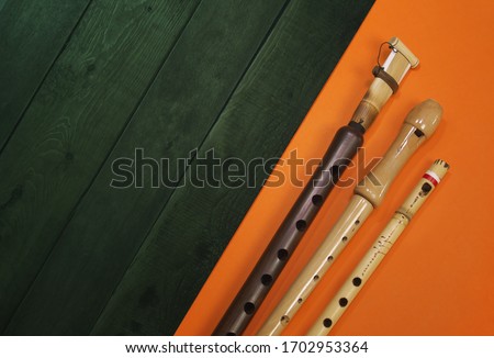 Flat lay 3 types of wooden flutes. Woodwind musical instruments with copy space