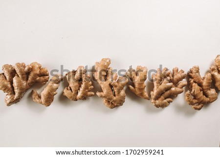 Natural ginger root border on white background. Web banner frame with copy space.