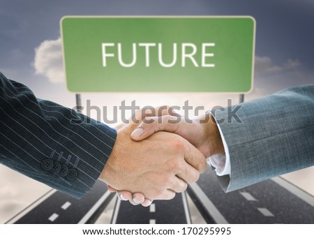 Composite image of business handshake against signpost showing the direction of the future