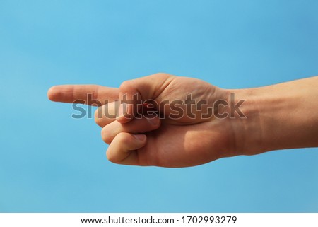 outstretched hand that helps show the way isolated on a stony background