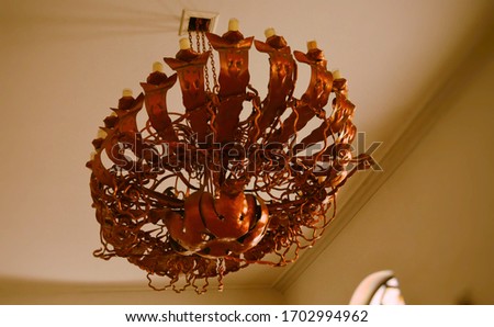 Old brown chandelier in the castle