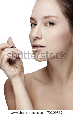 Close up portrait picture of beautiful woman with lipstick on the white background.-Studio shot