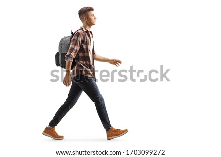 Full length profile shot of a male student with a backpack walking isolated on white background Royalty-Free Stock Photo #1703099272