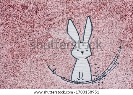 Pink cotton fluffy texture background with cute rabbit design