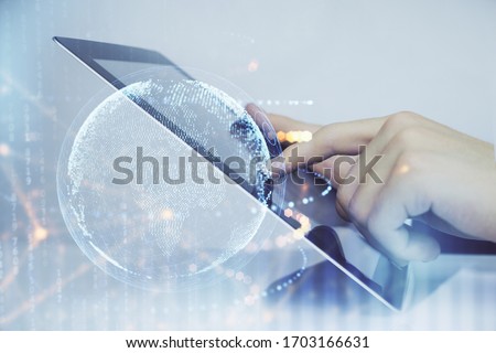 Multi exposure of man's hands holding and using a digital device and map drawing. International business concept. Royalty-Free Stock Photo #1703166631