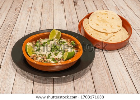 Dishes of tasty Mexican tacos