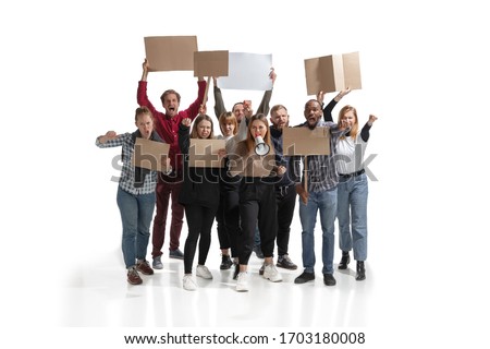 Emotional multicultural group of people screaming while holding blank placards on white background. Women and men shouting, calling. Activism, active citizenship, social life, protesting, human rights