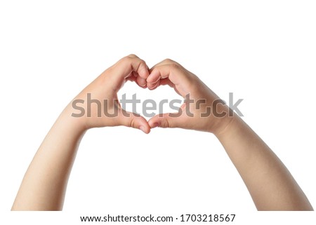 Gesturing of the heart from kid hands