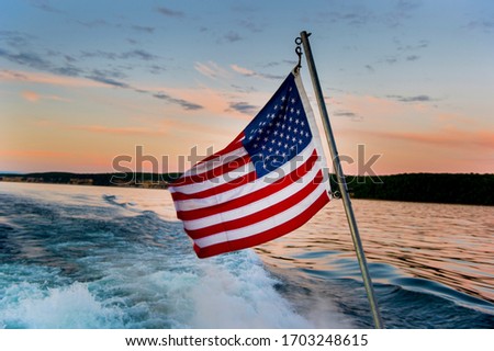 American flag on the back of a boat on Lake Superior.