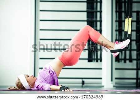 Young woman streching muscles functional training Royalty-Free Stock Photo #170324969