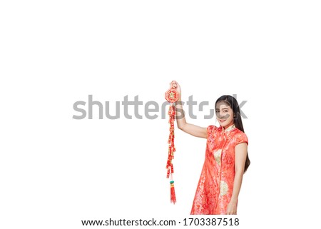 Beauty woman wear cheongsam and show something to you in chinese new year on white background,  (with the character "fu" meaning fortune)
