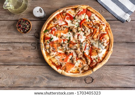 Fresh Barbecue Chicken Pizza with Vegetables and Mozzarella Cheese on wooden, top view, copy space. BBQ Pizza with chicken pieces.