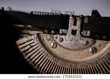 Typing "fake news" on retro typewriter